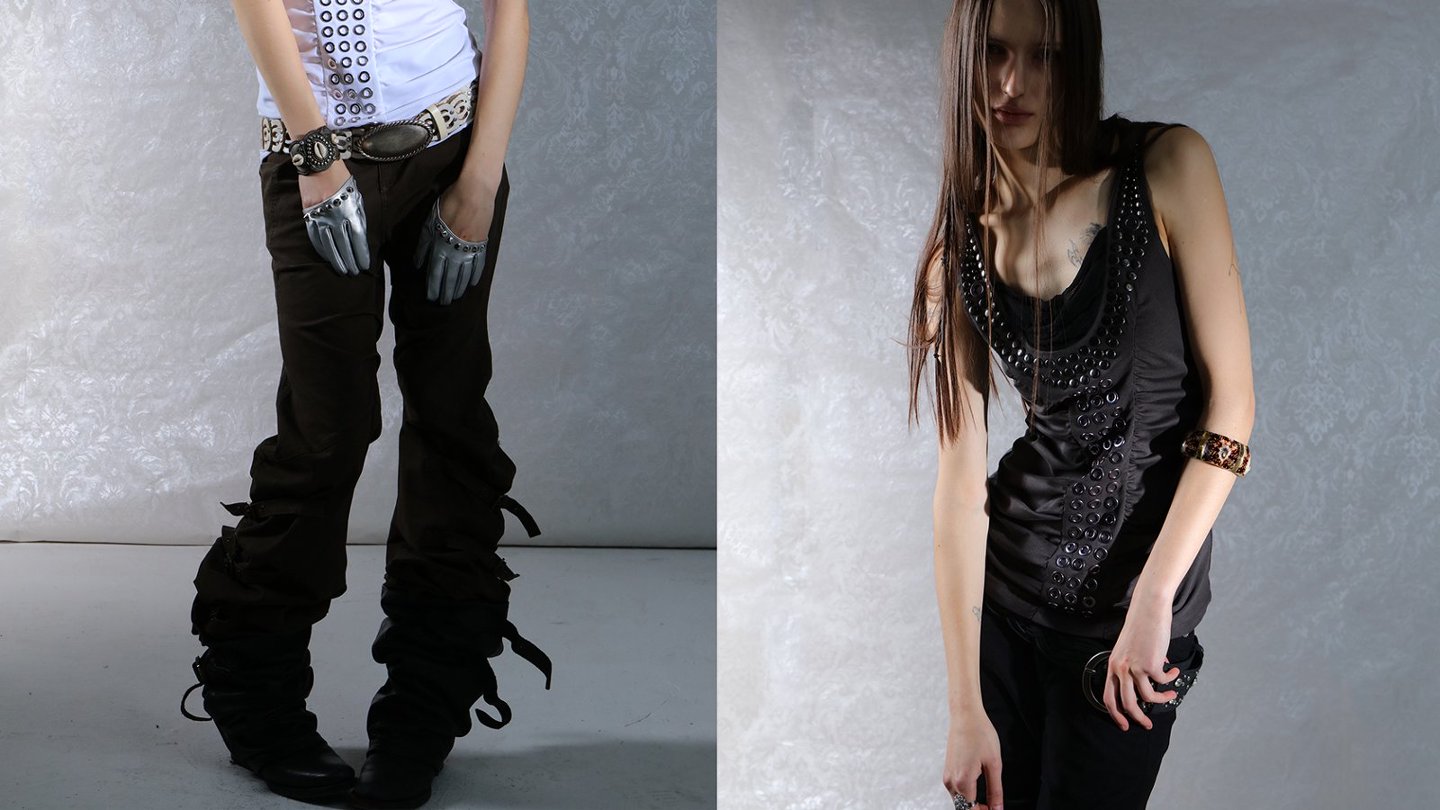 One of the campaign photos from Double Punch SS26 collection. Two views of a person wearing grunge style dark, embellished clothing with a textured gray background.